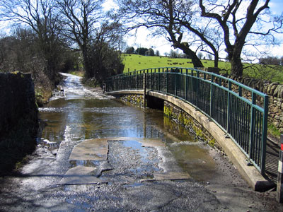 The pedestrian bridge over the water