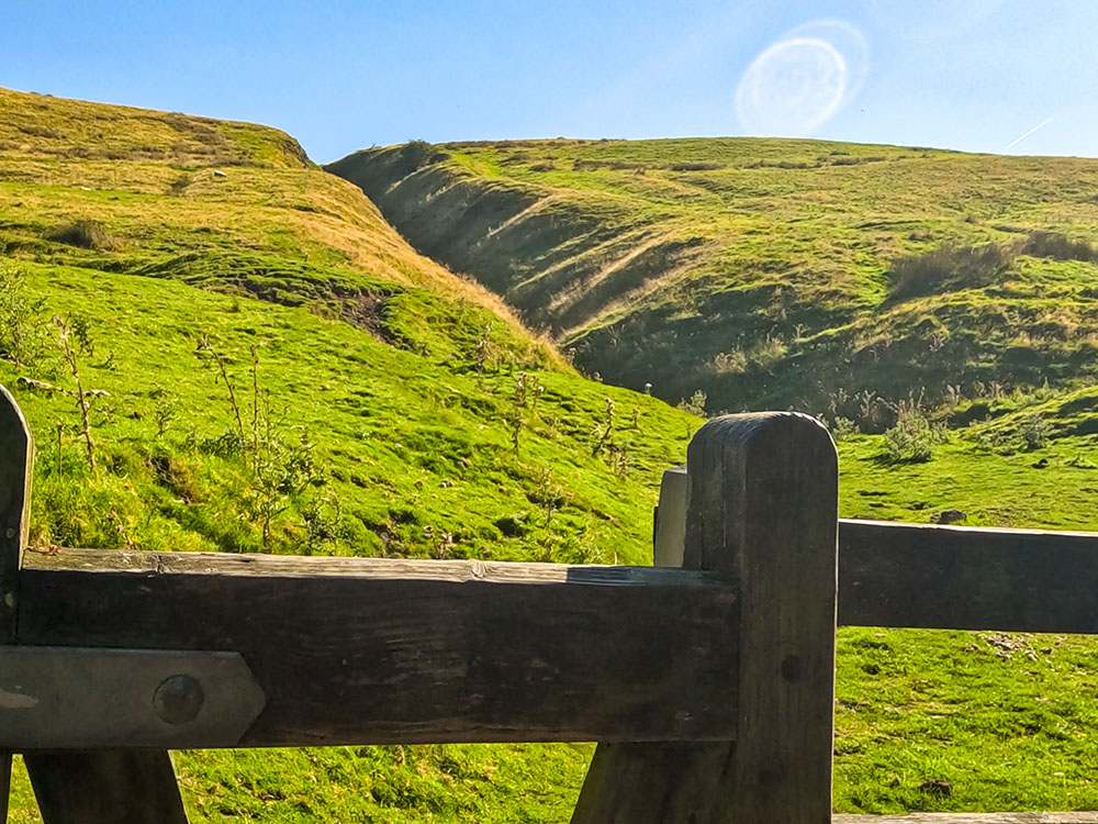 Looking at the path climbing the right-hand side of Burst Clough from the gate