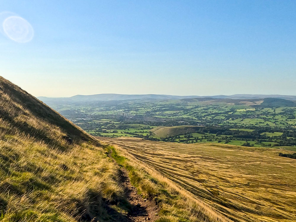 Heading down across Downham Moor on the descent off Pendle Hill