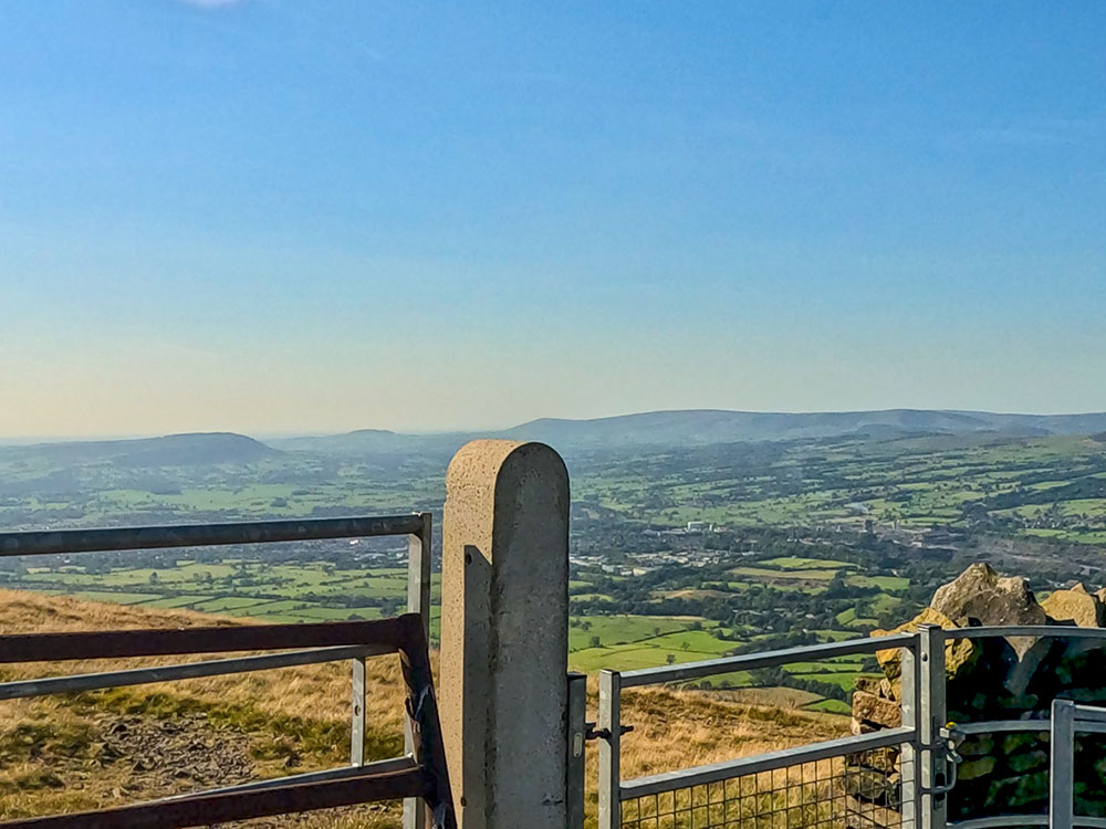 The view over Clitheroe and the Ribble Valley from the metal kissing gate