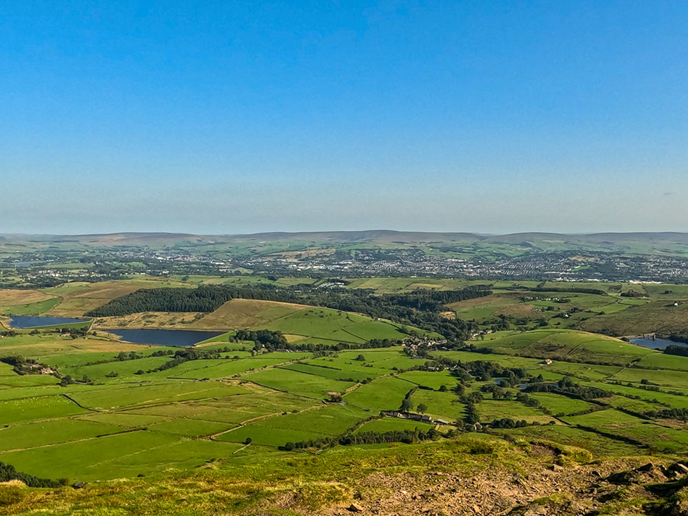 Looking down towards the Black Moss Reservoirs, Barley and Lower Ogden Reservoir from the summit of Pendle Hill