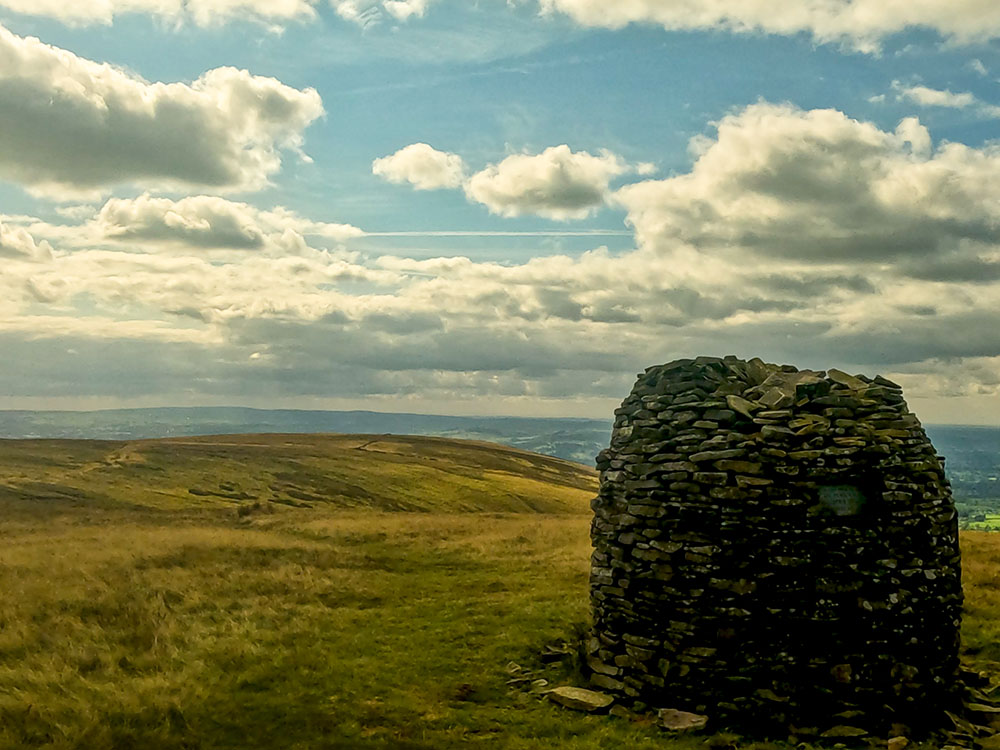 The onward path is visible down the left-hand side of the Scout Cairn