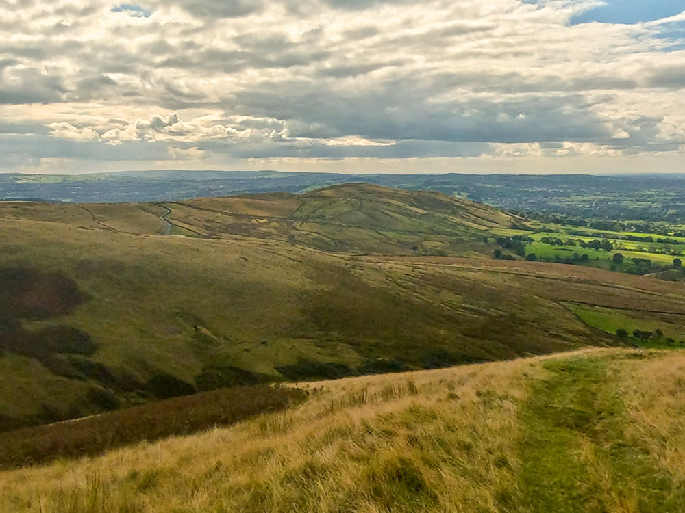 The path heads down to Howcroft Brook in Ashendean Clough below