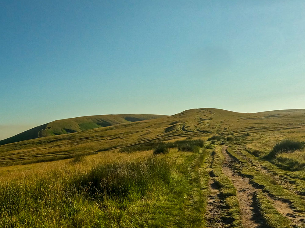 The wide track as it climbs over Pendleton Moor up towards Apronfull Hill