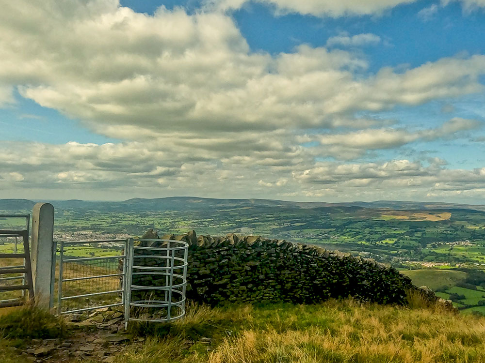 View from the metal kissing gate over Clitheroe and the Ribble Valley looking out to the west